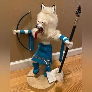Hand made Navajo wooden kachina wolf doll on wooden stand.